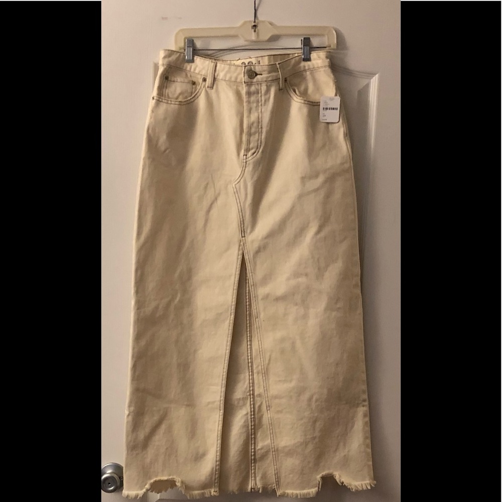Free People denim skirt with front split. Size 29. New with tags, never worn.